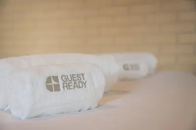 three towels with the text guest ready written on them at GuestReady - Cosy Studio Near Arrábida Shopping in Vila Nova de Gaia