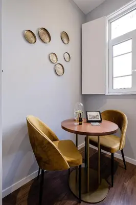 a dining room with a table and two chairs at Plaza - Charming GuestHouse in Porto