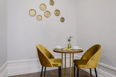 a dining room with a table and two chairs at Plaza - Charming GuestHouse in Porto