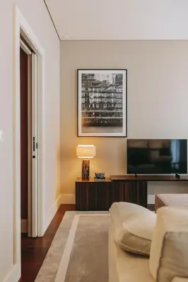 a living room with a couch and a television at Gran Cruz Apartments in Vila Nova de Gaia