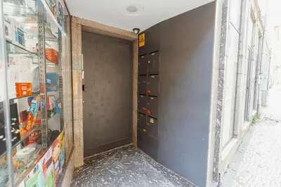 a gray door in a building with many boxes at Downtown Formosa Studio by Vacationy in Porto