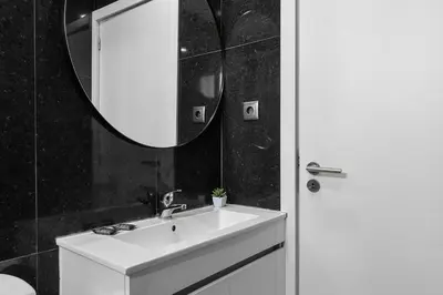 a bathroom with a shower and a glass door at GuestReady - Charming retreat in Porto in Porto