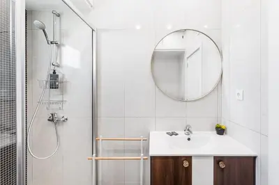 a bathroom with a sink and a shower with a mirror at GuestReady - Charming retreat in Porto in Porto