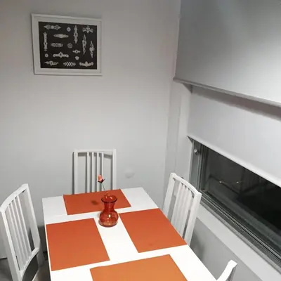 a dining room with a table and chairs at Miguel Bombarda - Porto Houses & Suites in Porto