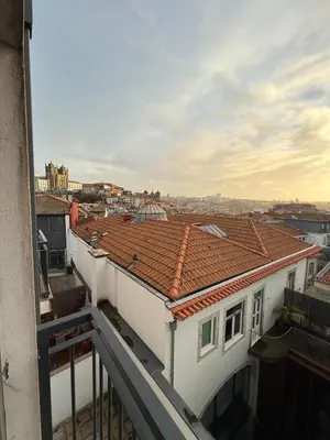 a bedroom with a black and white striped bed at Flores Street Apartment - Porto City Center in Porto