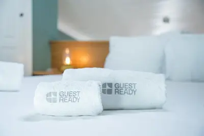 two towels on a counter with the text guest receipt at GuestReady-Cozy Duplex in Porto's Vibrant Heart in Porto