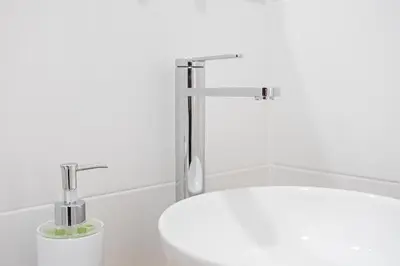 a bathroom with a sink and a faucet at GuestReady - Charming Studio in Porto Centre in Porto