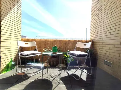 a small bedroom with a bed with a green blanket at Guest House Douro in Vila Nova de Gaia