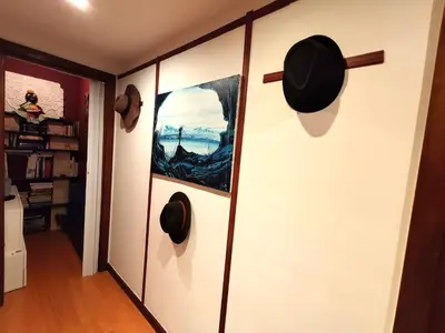 a bedroom with a bed and a room with a door at Apartamento familiar no centro de Gaia in Vila Nova de Gaia