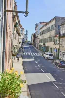 a view of an empty city street with buildings at Studio Palazzo, Antique Charm with Romantic Balcony and AC in Porto