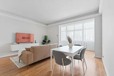 a living room with a table and a couch at GuestReady - Fantastic house in the city center in Porto