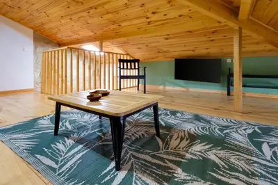 a living room with a table and a tv at Porto Covelo Park Apartment in Porto