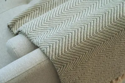 a tie sitting on the side of a couch at The Luminous by Lovely Memories - Pool Access in Porto
