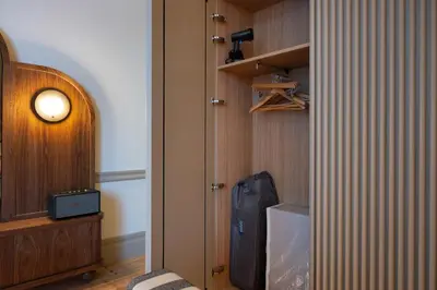 a room with a room with a suitcase and a light at Aliados 9 - Luxury in the Heart of Porto in Porto