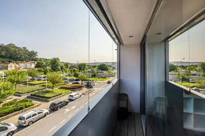 a balcony with a view of a parking lot at Nomad's Lux - 2bdr & Parking Flores Square Porto in Porto