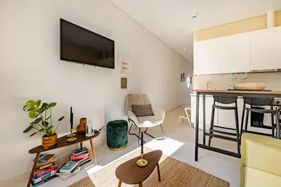 a small living room with a table and a couch at Charming & Sunny Stay in Historic Porto in Porto