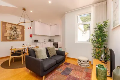 a living room with a couch and a table at YOUROPO - Cosy in Porto