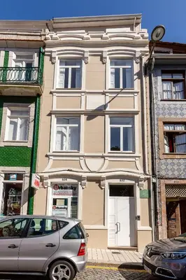 a silver car parked in front of a building at YOUROPO - Cosy in Porto