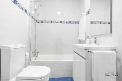 a white bathroom with a toilet and a sink at 2Bedroom Flat - Families, remote work, downtown - Private Garage in Porto