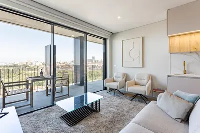 a living room with a couch and a table at Modern Porto Retreat by HostWise in Vila Nova de Gaia