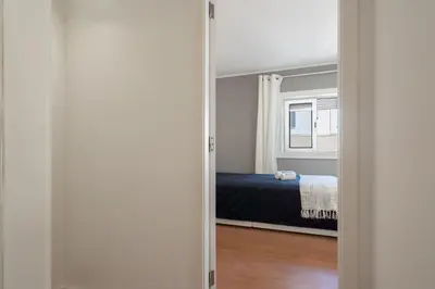 a door leading into a bedroom with a bed at Authentic Porto Home by HostWise in Porto