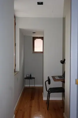 a living room with a wooden table and chairs at Porto Central Apartment in Porto