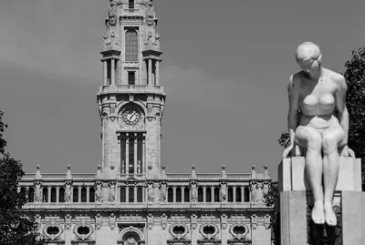 a statue in front of a building with a clock tower at Welcome to my city 2 in Porto