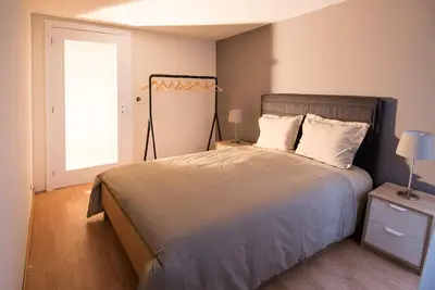 a bedroom with a large bed and a window at Welcome to my city 2 in Porto