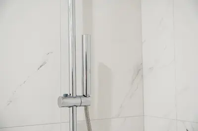 a toothbrush holder in a bathroom with white walls at GuestReady - Elegant stay in Central Porto in Porto