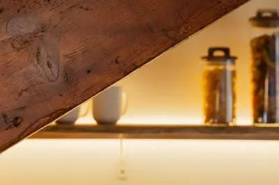 a shelf with a jar and other items on it at The Terraced Loft - Boho Elegance in Porto in Porto