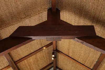 a wooden cross on top of a wall at The Terraced Loft - Boho Elegance in Porto in Porto