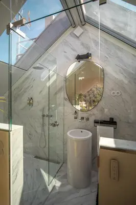 a bathroom with a shower and a sink and a mirror at The Dome in Porto