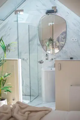 a bathroom with a shower and a mirror at The Dome in Porto