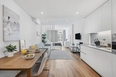 a kitchen and a living room with a table in a room at Timeless Porto Studio @ Marquesa Palace in Porto