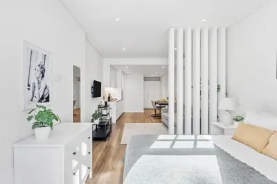 a white living room with a couch and a table at Timeless Porto Studio @ Marquesa Palace in Porto
