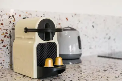 a toaster sitting on top of a counter at Vila Rio Guest House in Vila Nova de Gaia
