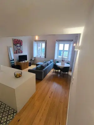 a living room with a couch and a table at ALMADA LOFT LIVING by We Do Living in Porto