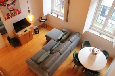 a living room with a couch and a table at ALMADA LOFT LIVING by We Do Living in Porto