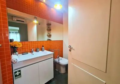 a bathroom with a sink and a toilet at D Joao Premium Suite Bolhao Metro in Porto