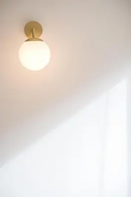 a ceiling light with a white wall at Modern 1BR Apartment - Brand New Bonjardim I in Porto