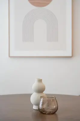 a table with a candle and a glass bowl at Modern 1BR Apartment - Brand New Bonjardim I in Porto