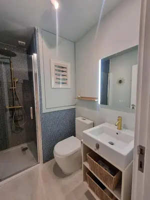 a bathroom with a toilet and a sink and a shower at Lovely Studio in the Heart of Historic Porto in Porto