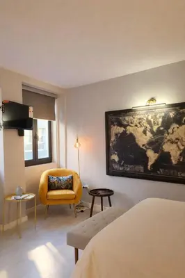 a room with a map of the world on the wall at Lovely Studio in the Heart of Historic Porto in Porto