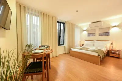 a bedroom with a bed and a table with a dining room at ON Apartments - MA62 Downtown in Porto
