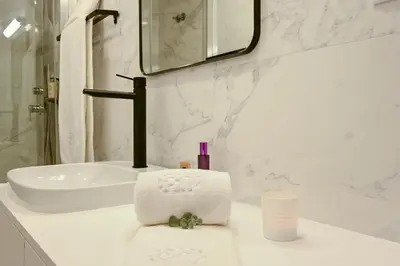 a bedroom with a bed with two towels on it at ON Apartments - MA62 Downtown in Porto