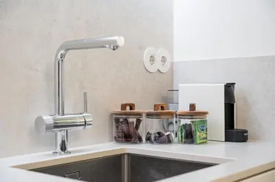 a kitchen counter with a sink and a sink at Unique Luxury and Quiet in Porto Best Location in Porto