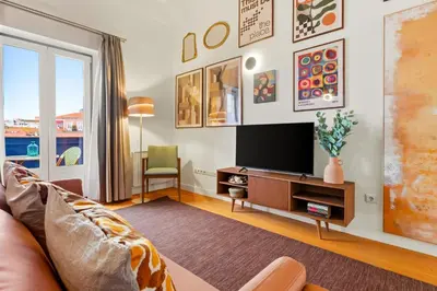 a living room with a couch and a tv at Duque 3 Luxury Apartment Downtown Porto near Metro in Porto