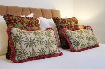 a group of pillows sitting on top of a bed at Duque 3 Luxury Apartment Downtown Porto near Metro in Porto