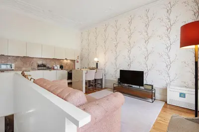 a living room with two couches and a tv at Alma D'oporto 556 – Elegant T1 in Porto