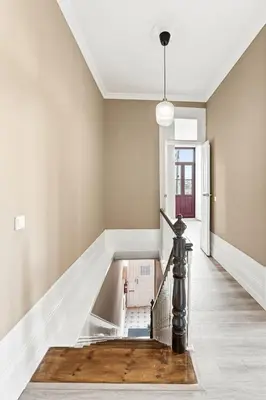 an empty hallway with a staircase in a house at GuestReady - Charming Gaia apartment in Vila Nova de Gaia
